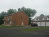 The sides of this duplex in brick offer the beauty of masonry all around