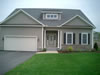 home with Cultured Stone entry and skirt 